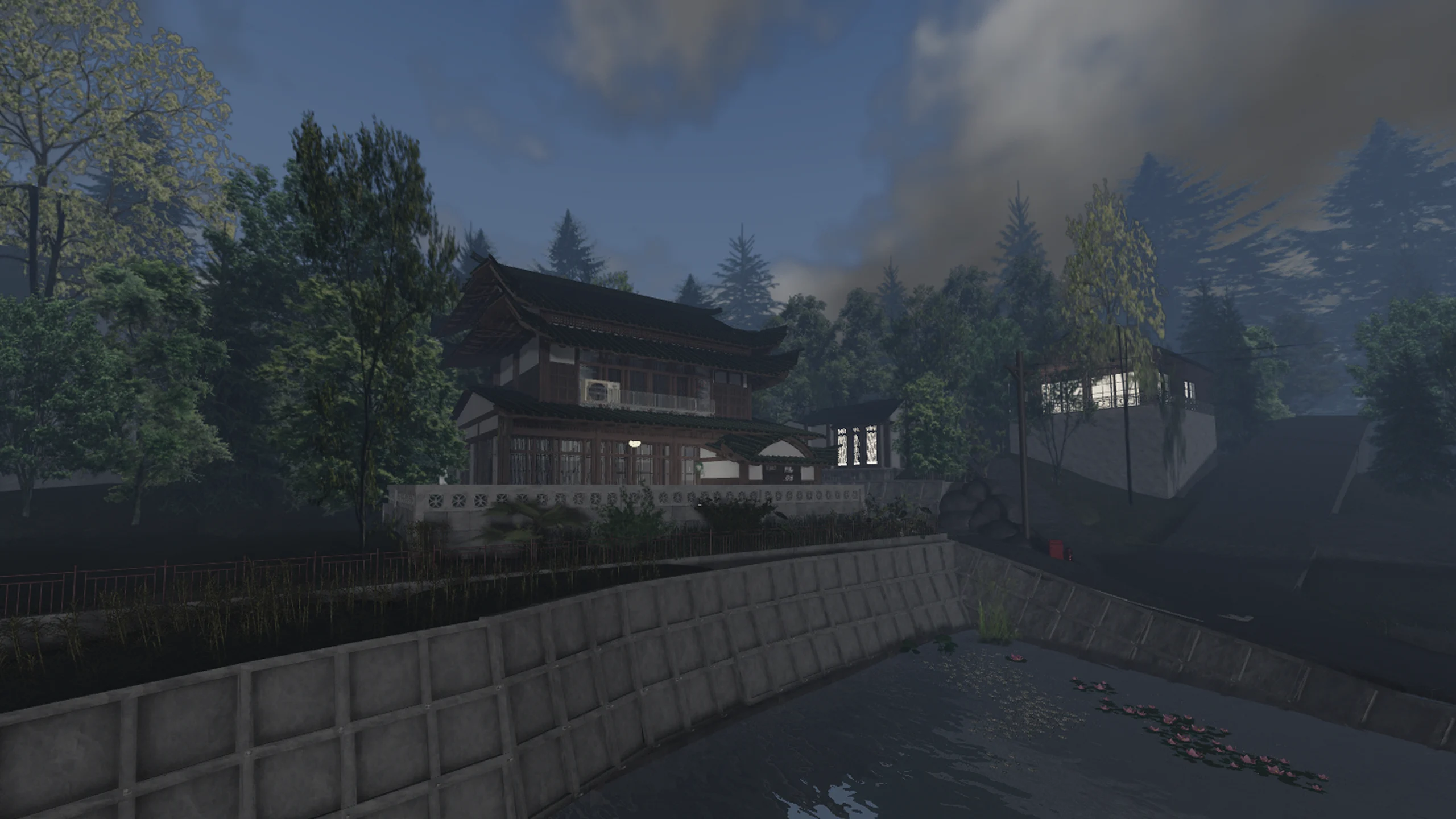 An Eastern-inspired architectural build beside water and trees.
